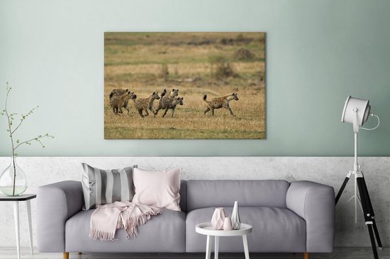 Canvas Schilderij Hyena's - Jagen - Afrika - 120x80 cm - Wanddecoratie