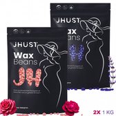 Twee zwarte zakken JHust Wax Beans met respectievelijk roze en paarse bonen, versierd met rozen en lavendel. "2X 1 KG".