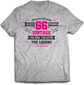 66 Jaar Legend - Feest kado T-Shirt Heren / Dames - Antraciet Grijs / Roze - Perfect Verjaardag Cadeau Shirt - grappige Spreuken, Zinnen en Teksten. Maat M