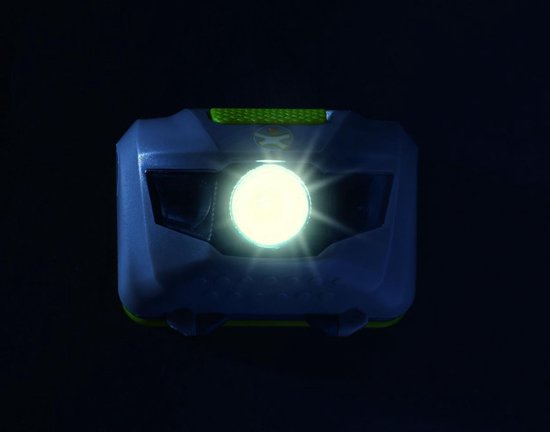 Grijze hoofdlamp met een helder brandende witte lamp in het midden en groene accenten.