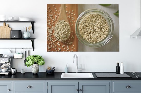 Canvas schilderij 120x80 cm - Wanddecoratie Quinoa in een glazen kom en op een houten lepel - Muurdecoratie woonkamer - Slaapkamer decoratie - Kamer accessoires - Schilderijen op canvas
