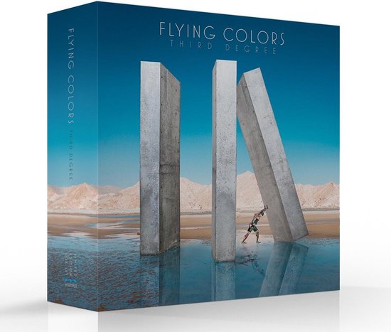 Een boxset met 3 grote stenen op het strand en een gedetailleerde afbeelding van een mens met een kunstzinnig patroon.
