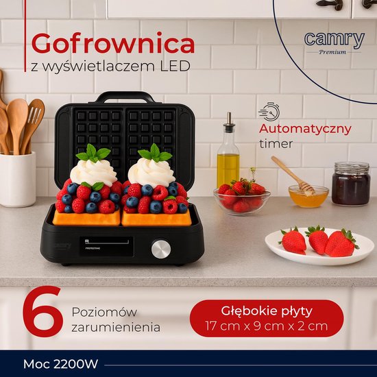 Open wafelijzer met twee wafels versierd met slagroom en fruit, met tekst 'Gofrownica z wyświetlaczem LED'.