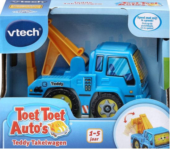 Blauwe VTech takelwagen met gele kraan in de verpakking. De verpakking vermeldt "Teddy Takelwagen" en "1-5 jaar".