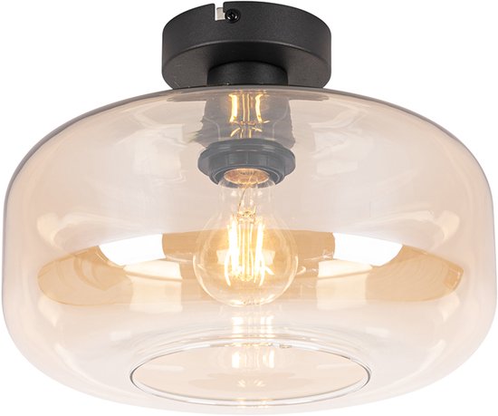 Een amberkleurige glazen plafondlamp met een zwarte basis.
