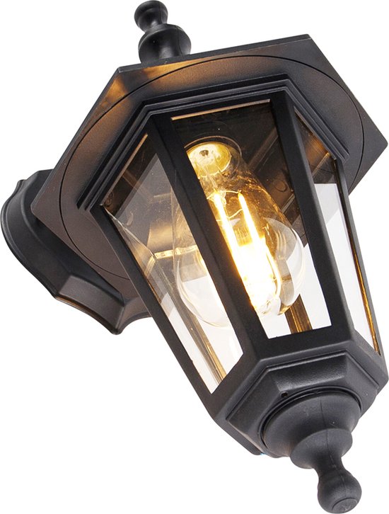 Klassieke zwarte wandlamp met glas, zichtbare peertje en details.