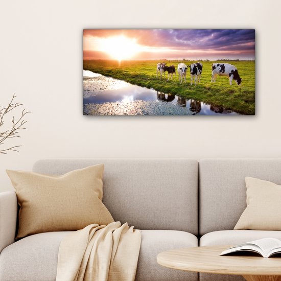 Tableau sur toile Vaches pendant un coucher de soleil - 80x40 cm - Décoration murale Art