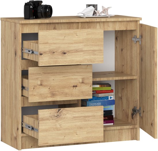 Dressoir met 3 uitgeschoven lades en een open deur aan de rechterkant, gevuld met boeken.