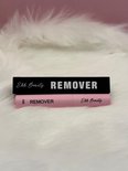Roze removerfles met zwarte verpakking. De fles heeft 'REMOVER' en 'Ehh Beauty' erop.