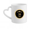 Tasse blanche avec anse en forme de cœur, ornée d'un cercle doré avec 4 étoiles et '30 JAAR' au centre.