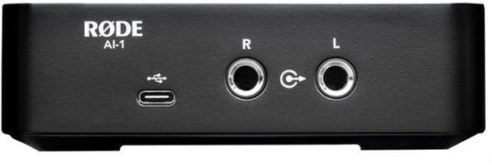 Zwarte RØDE AI-1 audio interface met USB-C en links/rechts hoofdtelefoonaansluitingen.