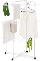 Witte droogtoren met 3 niveaus, met kleding en groene sokken.