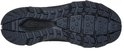 Zool van zwarte mid-cut wandelschoen met grof profiel en Skechers S-logo.