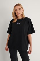 NA-KD Karma Printed Dames T-shirt - Maat XL