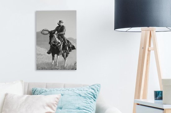 Peinture sur toile Un cow-boy sur un cheval gris ciel - noir et blanc - 20x30 cm - Décoration murale