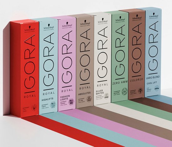 Rij van zeven IGORA ROYAL haarkleurdozen in verschillende kleuren, van rood tot blauw.