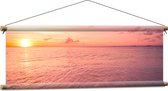 Textielposter - Zon Zakkend in de Zee onder Rozekleurige Lucht - 90x30 cm Foto op Textiel