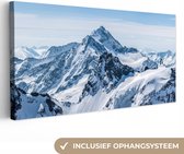 Canvas Schilderij Bergen - Sneeuw - Winter - Natuur - Landschap - 80x40 cm - Wanddecoratie