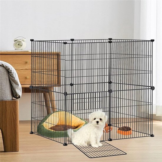Zwarte metalen puppyren met een witte puppy, een mand en een voerbak binnenin.