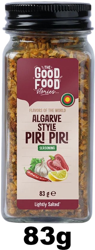 Pot met etiket: 'The Good Food Stories, Algarve Style Piri Piri', 83g. Bevat afbeeldingen van chili, knoflook en citroen.