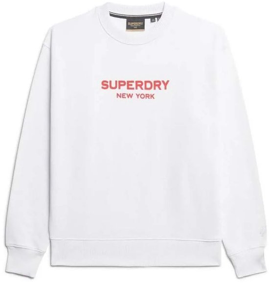 Sweat Superdry blanc avec l'inscription rouge "SUPERDRY NEW YORK" sur la poitrine et étiquette.
