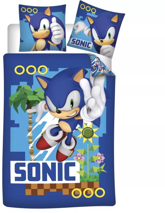 Blauw dekbedovertrek met Sonic die gebaart. Met goudkleurige ringen en pixelachtige achtergrond.