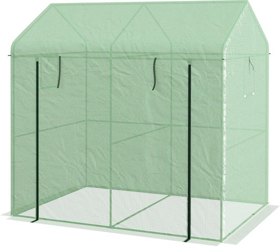 Groene kas van voren gezien, met een stalen frame en een oprolbare deur.