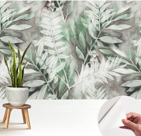 Zelfklevend vliesbehang met aquarelbladeren, weergegeven met een plant en een afgepelde hoek voor applicatie.