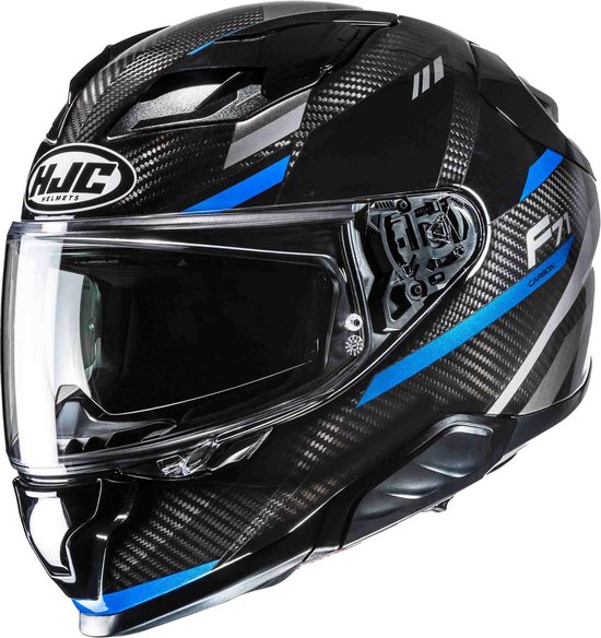 HJC F71 Carbon Esira helm met koolstofvezelpatroon, blauwe accenten en helder vizier.