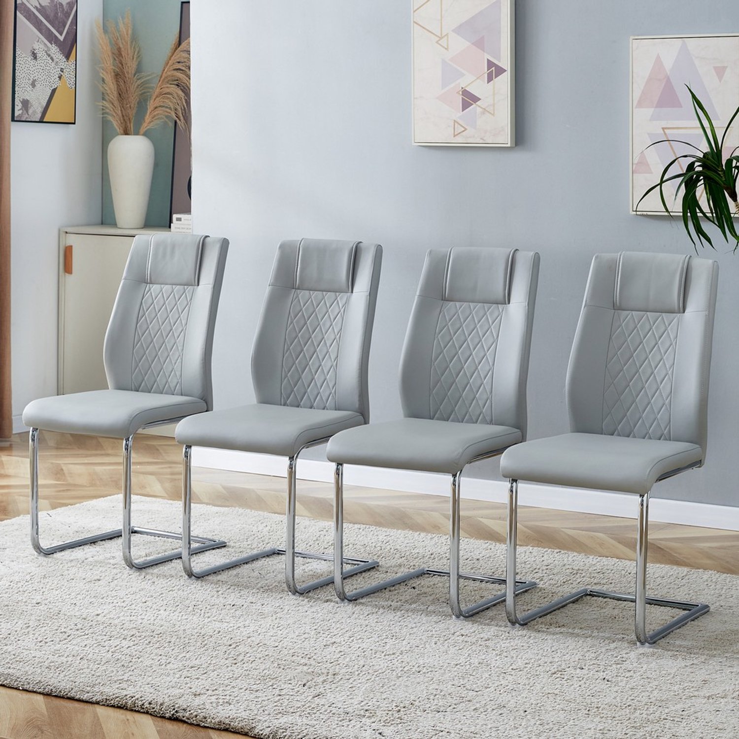 Pugsdrly Eetkamerstoelen - Set van 4 - Lichtgrijs - PU-leer - Rugleuning in gaaslook - Glanzend zilveren metalen poten - Antislipvoetjes Lichtgrijs, zilver