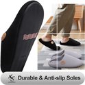 Zwarte pantoffel met anti-slip zool en golfpatroon, met de tekst 'Durable & Anti-slip Soles'.