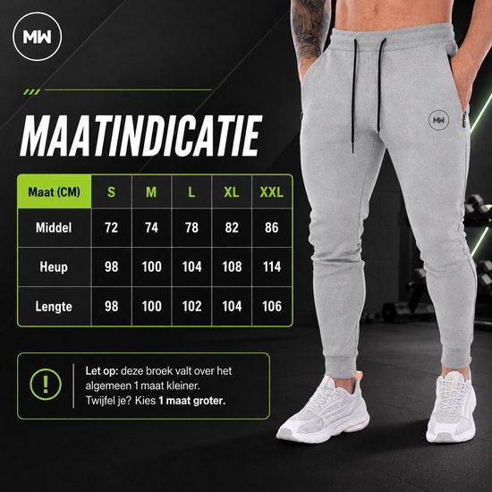 Grijze trainingsbroek met MW logo, ritszakken en trekkoord. Maattabel met maten S tot XXL. "Let op: deze broek valt over het algemeen 1 maat kleiner. Twijfel je? Kies 1 maat groter."