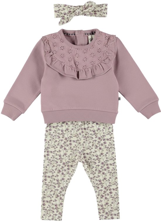 Paarse trui met rucheskraag met bloemenprint, bloemenprint legging en bijpassende haarband.