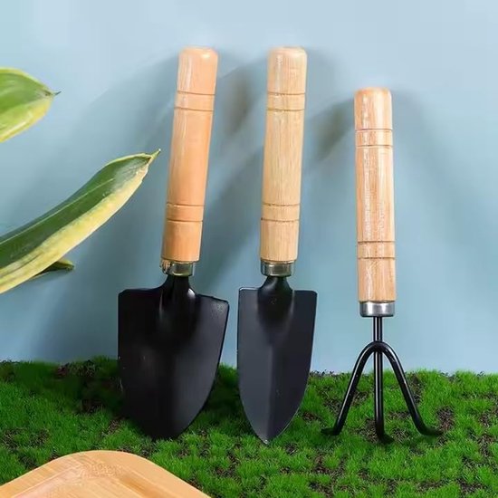 Deze 3-delige mini-tuingereedschapset bevat een schep, een spade en een hark met ergonomische houten handvatten, waardoor hij ideaal is voor het planten, wieden en omspitten van de grond. — afbeelding 3