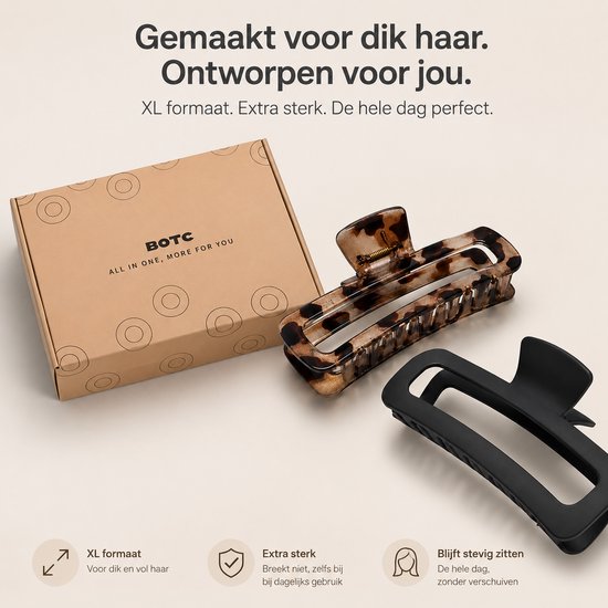 Doos met BOTC logo, een luipaardprint haarklem en een zwarte XL haarklem, gemaakt voor dik haar.