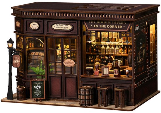 Lumann 3D puzzel van een hoekcafé met een lamp, vitrines, toonbank en barkrukken, gedetailleerd en verlicht.