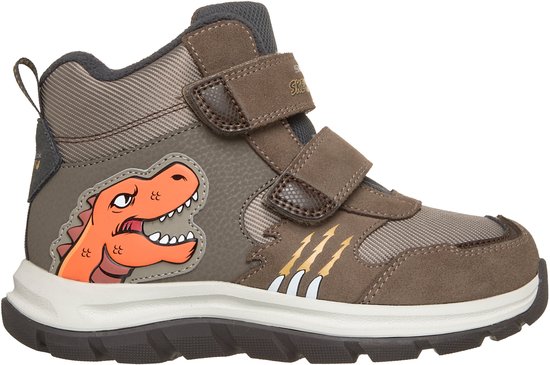 Bruine sneaker met klittenbandsluiting, oranje dinosaurus opdruk, en gele klauw-details. Zijaanzicht.