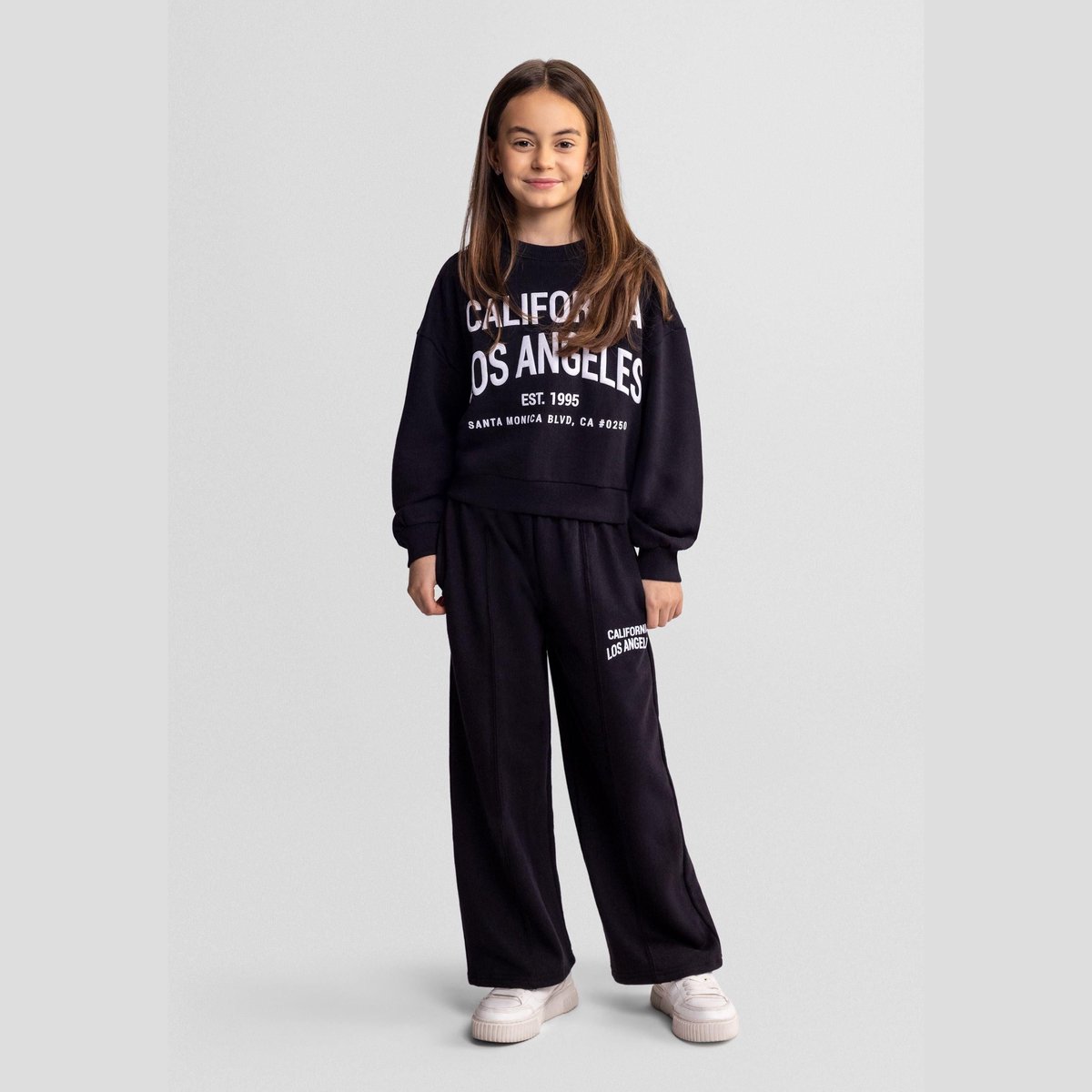Minoti trainingspak meisjes zwart met California print - relaxed