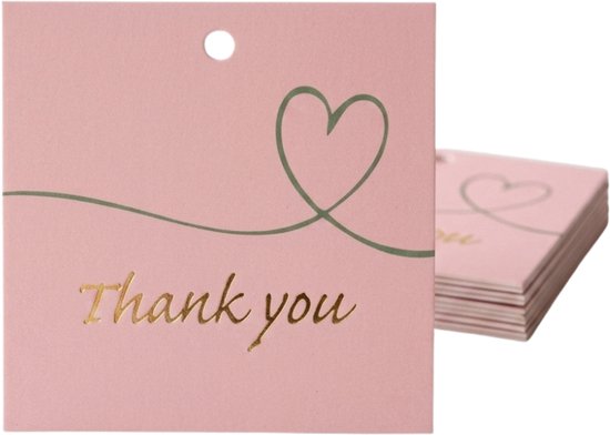 Pile de petites cartes roses avec inscription dorée "Thank you", motif de cœur et trou prépercé.