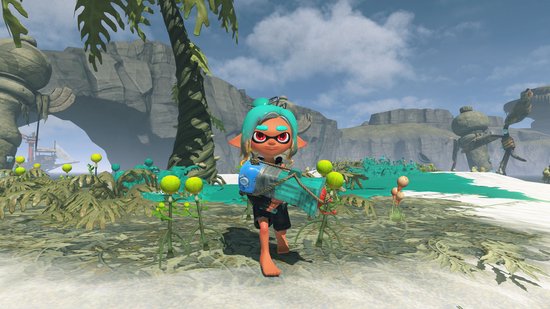 Een personage met turkoois haar houdt een blauw wapen vast in een jungle-achtige omgeving met planten en rotsen.
