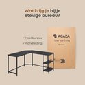 Zwart hoekbureau met deksel en handleiding.