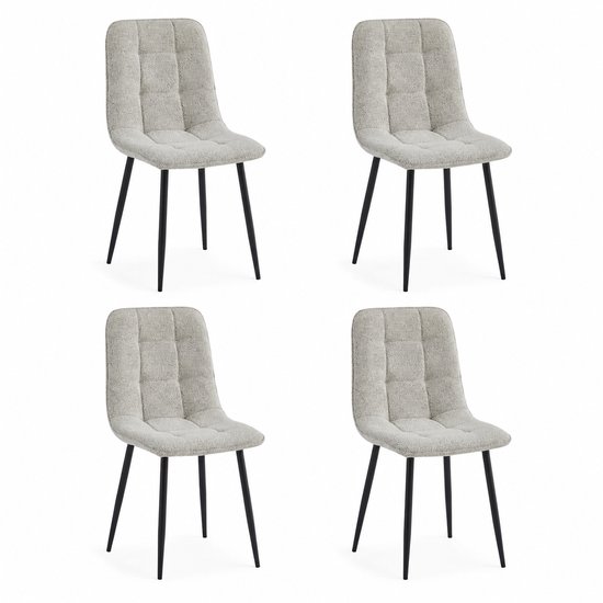 Quatre chaises de salle à manger en tissu bouclé blanc cassé, assise et dossier capitonnés, et pieds en métal noir.