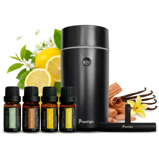 Zwarte Pretsigo diffuser met vier essentiële oliën: White Tea, Sandalwood, Lemon, Vanilla. Citroenen, kaneelstokjes en vanillepeulen.