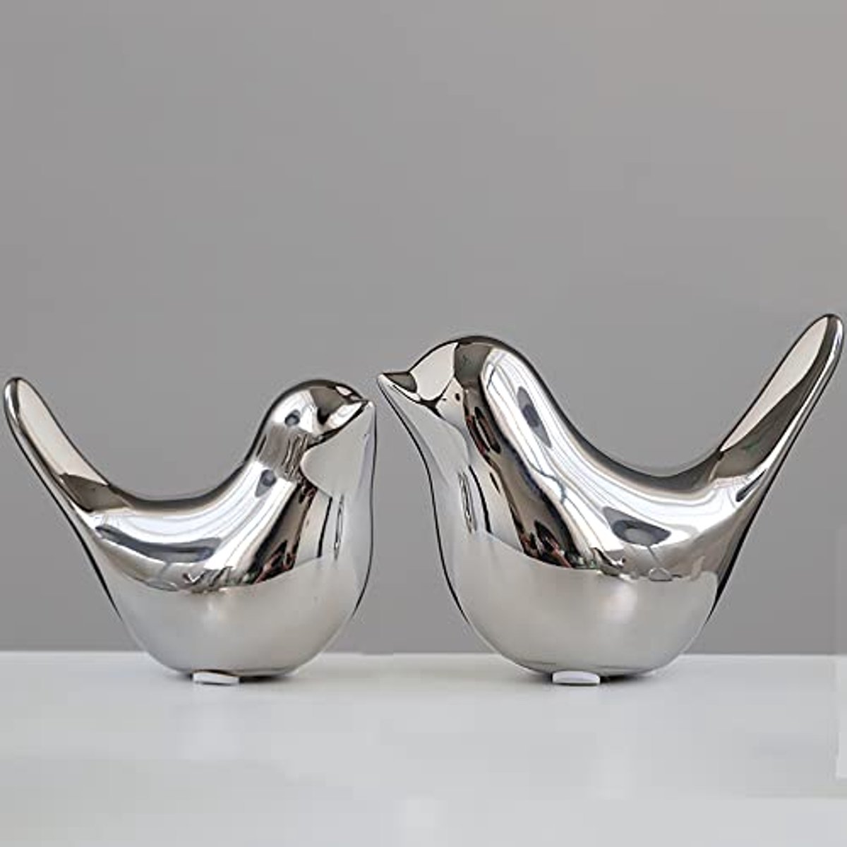 Zilveren Vogeltjes Decoratie Set - 2 Delige Keramische Vogel Beeldjes - Kleine Vogelfiguur Ornamenten voor Woonkamer Slaapkamer Kantoor Tafel Decoratie - Modern Woonaccessoire Cadeau - Zilver