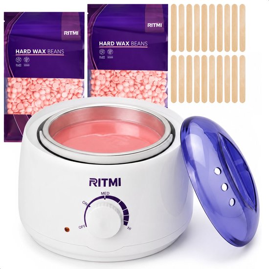 Witte wax ontharingsapparaat met blauwe deksel, veel roze waxbonen en strijkplankjes op de achtergrond.