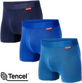 Drie Undiemeister boxershorts in verschillende blauwtinten, van donkerblauw tot lichtblauw.