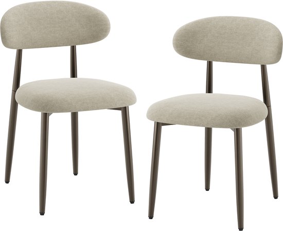 Twee beige gestoffeerde stoelen met gebogen rugleuningen en donkere metalen poten, op witte achtergrond.