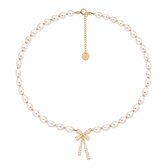 Gouden ketting met ovale parels, 5cm verlengketting en een strikhanger met zirkonia.