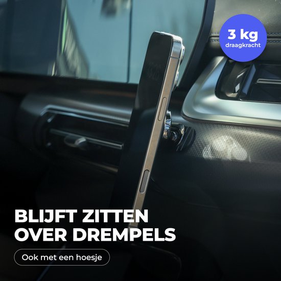Een smartphone met een telefoonhouder wordt stevig vastgehouden op het dashboard van een auto, zelfs over drempels. "3 kg draagkracht" is zichtbaar.