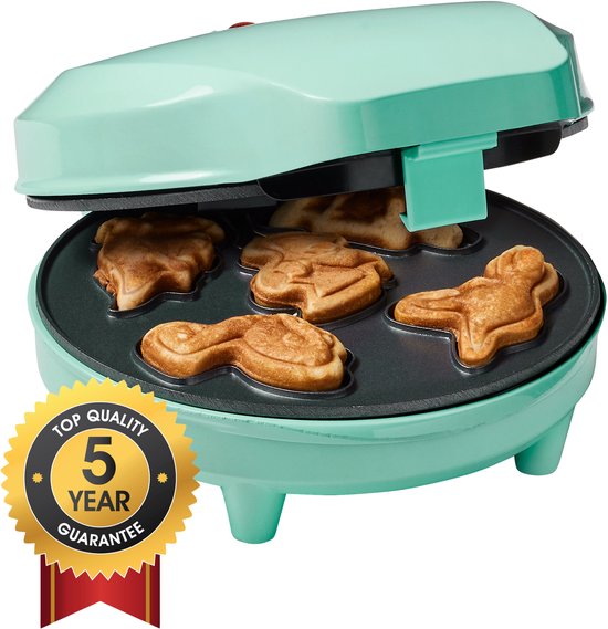 Mintgroen wafelijzer met 5 dinosaurussen, klaar om te bakken. Met 'Top Quality 5 Year Guarantee' zegel.